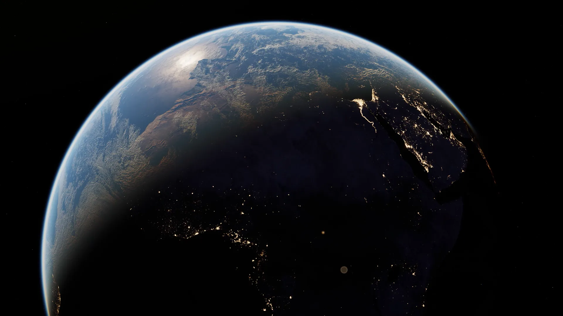 The day/night line with city lights appearing